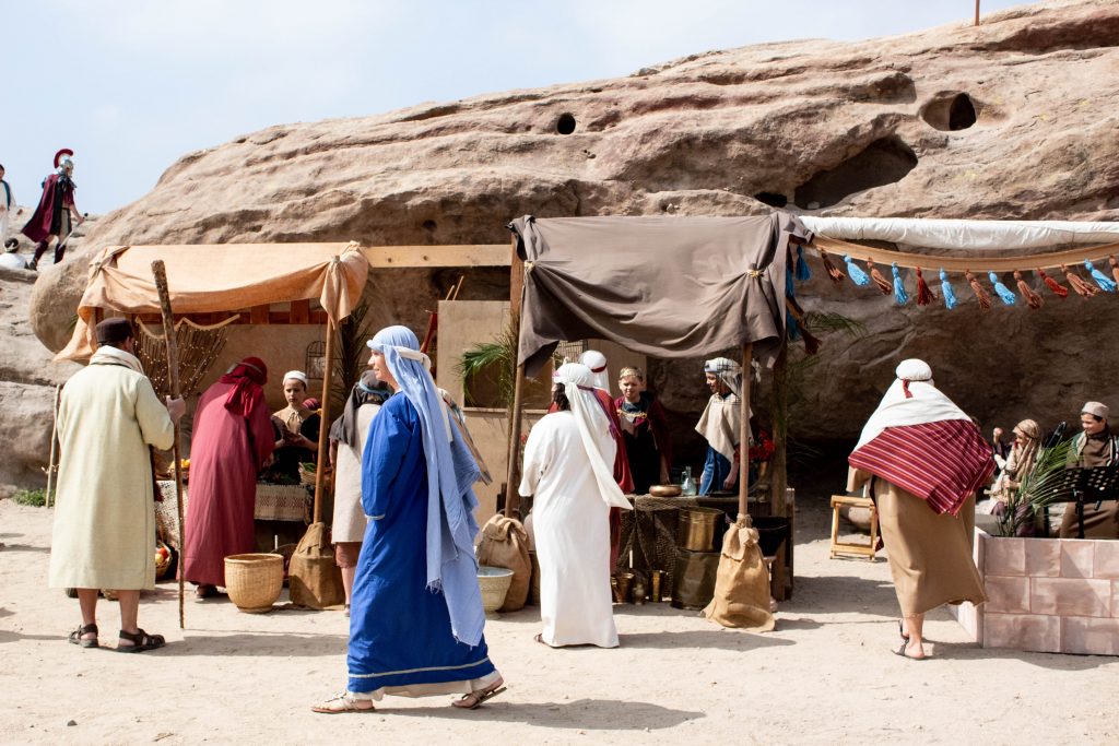 Woman walking across the marketplace in Jerusalem